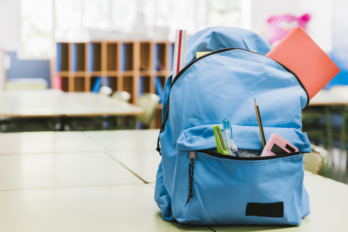 blue-schoolchild-backpack-table.jpg